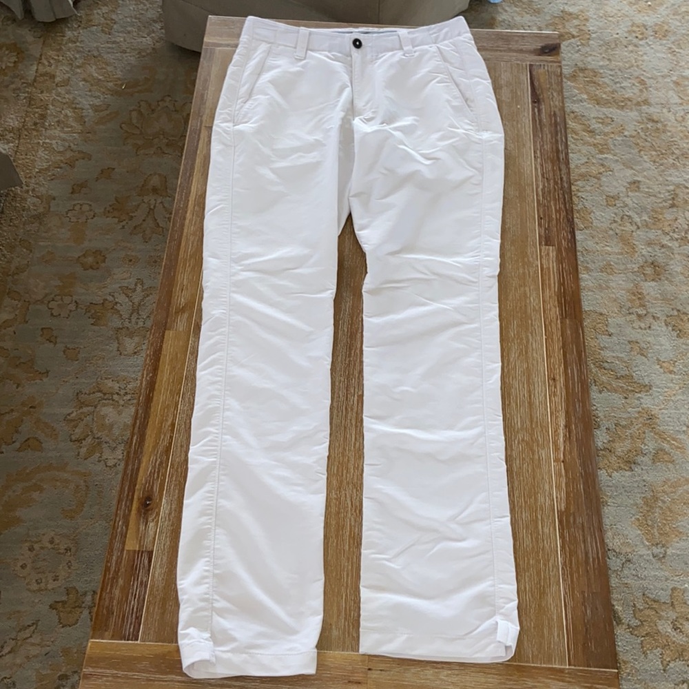 White under Armour golf pants.